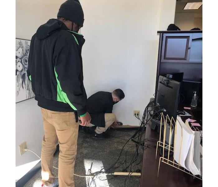 SERVPRO employees scoping a water loss in a commercial building